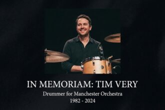 Manchester Orchestra drummer Tim Very performing live on stage.