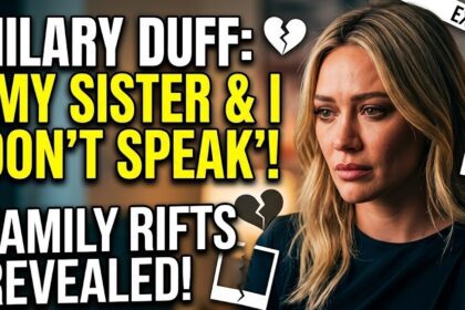 Hilary Duff at a 2026 album release event, looking contemplative in a synth-pop inspired outfit.