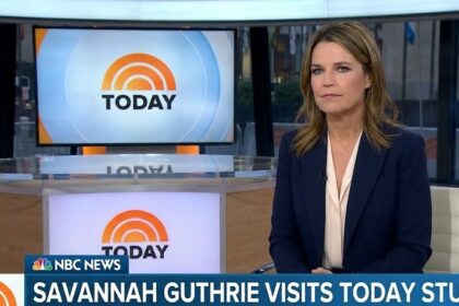 Savannah Guthrie hugging a colleague while wiping tears
