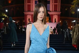 A sophisticated digital composite showing Sunday Rose Kidman Urban in her silver Oscar de la Renta gown, flanked by high-fashion runway analytics and film reel motifs.